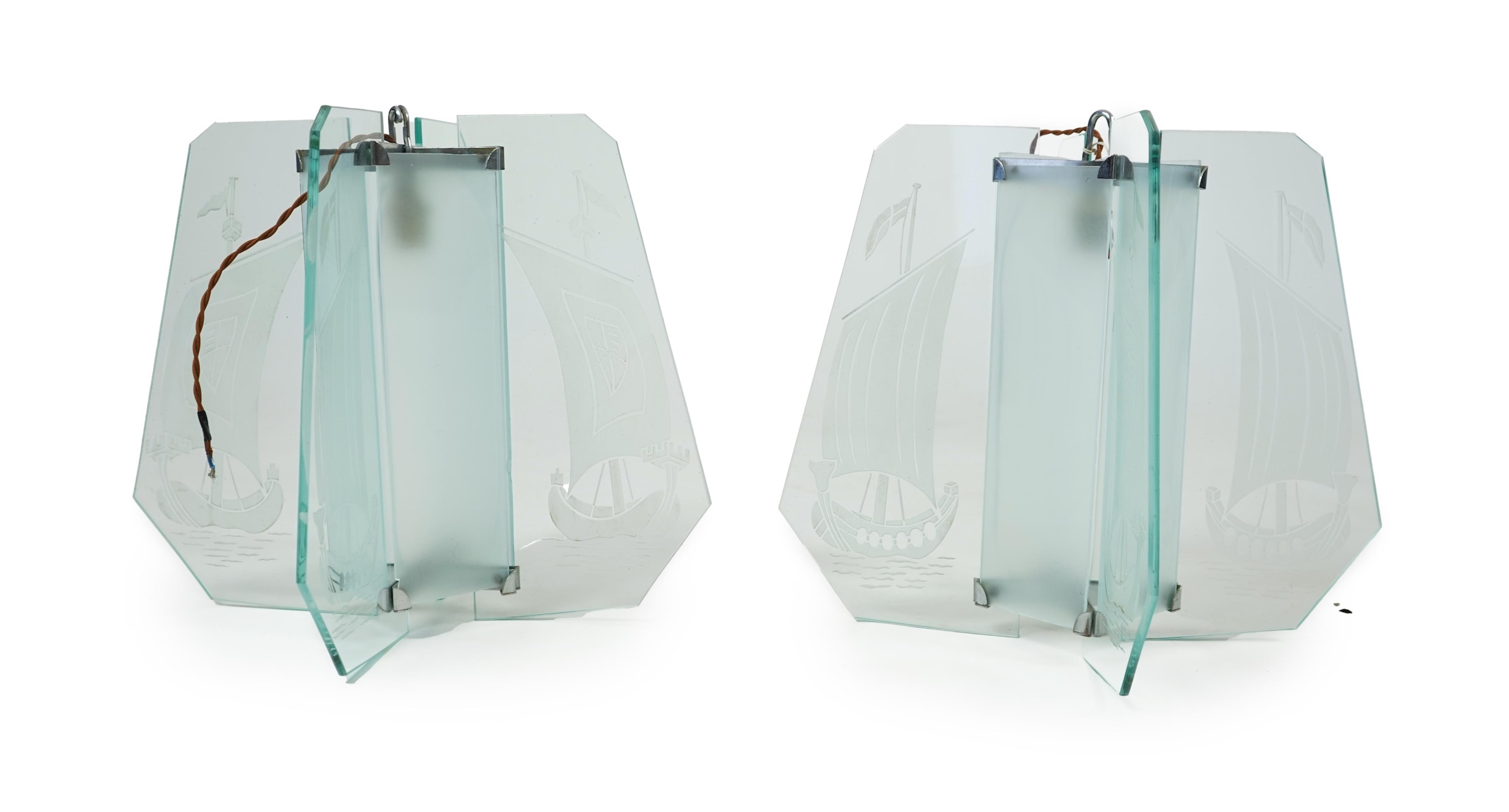 A pair of Art Deco chrome and four panelled etched glass ‘Galleon’ designed celling pendant lights